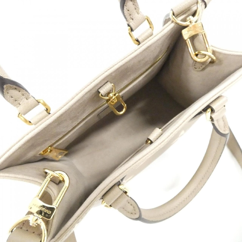 Túi Louis Vuitton Monogram Bicolor OnTheGo PM M45779 617561