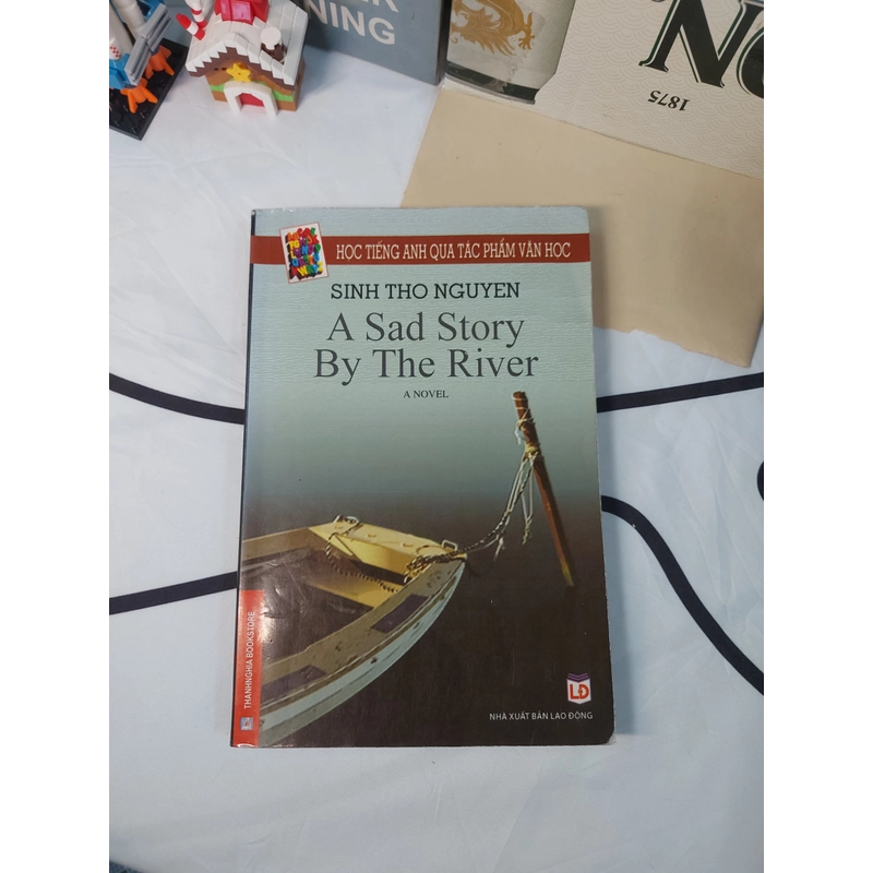 Sách song ngữ Anh - Việt - A sad story by the river 478107