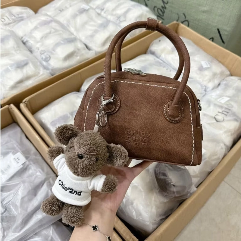 túi xách màu nâu size 20 kèm gấu 544343