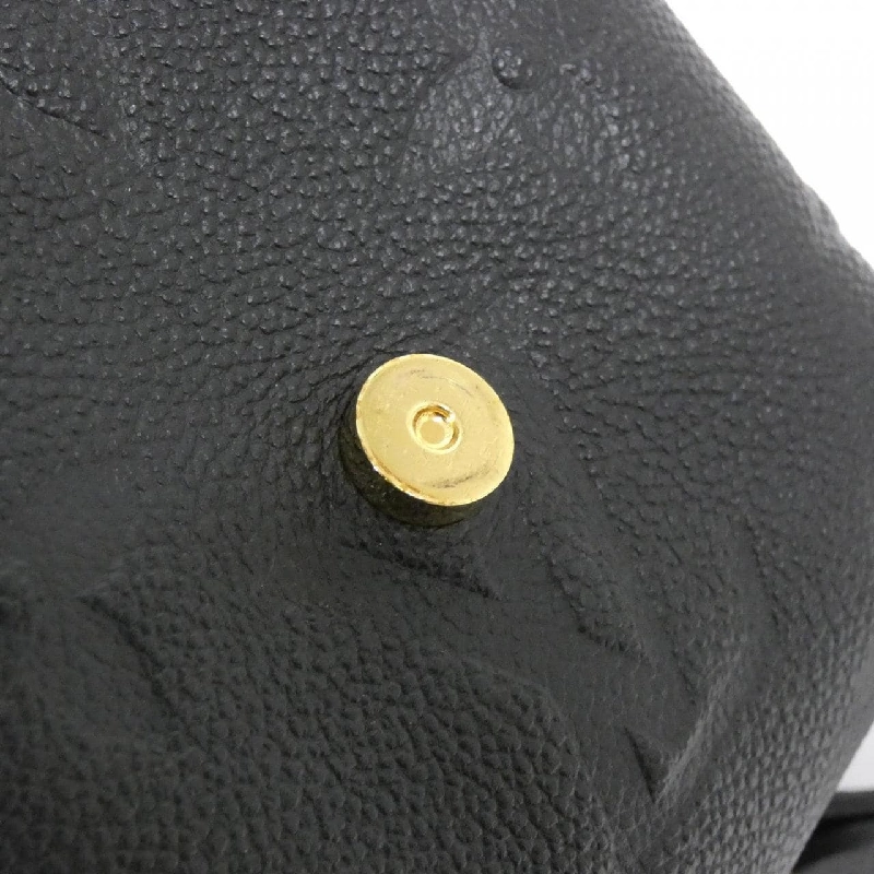 Ba lô Tiny Monogram Empreinte Louis Vuitton M80596 611183