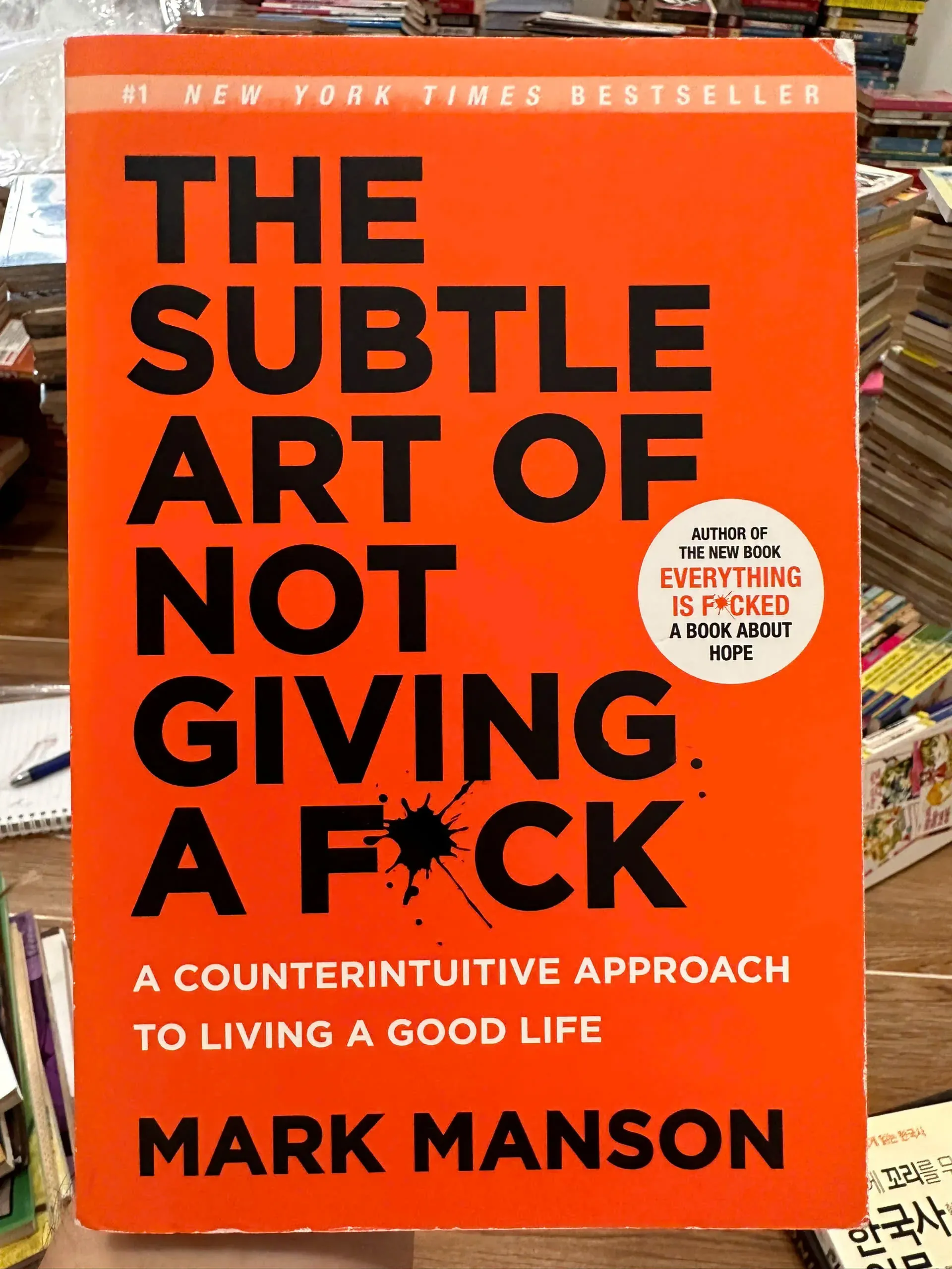 The Subtle Art of Not Giving a F\*ck: A Counterintuitive Approach to Living a Good Life by  - Sách Book Cover - Ngọc Hiển Books