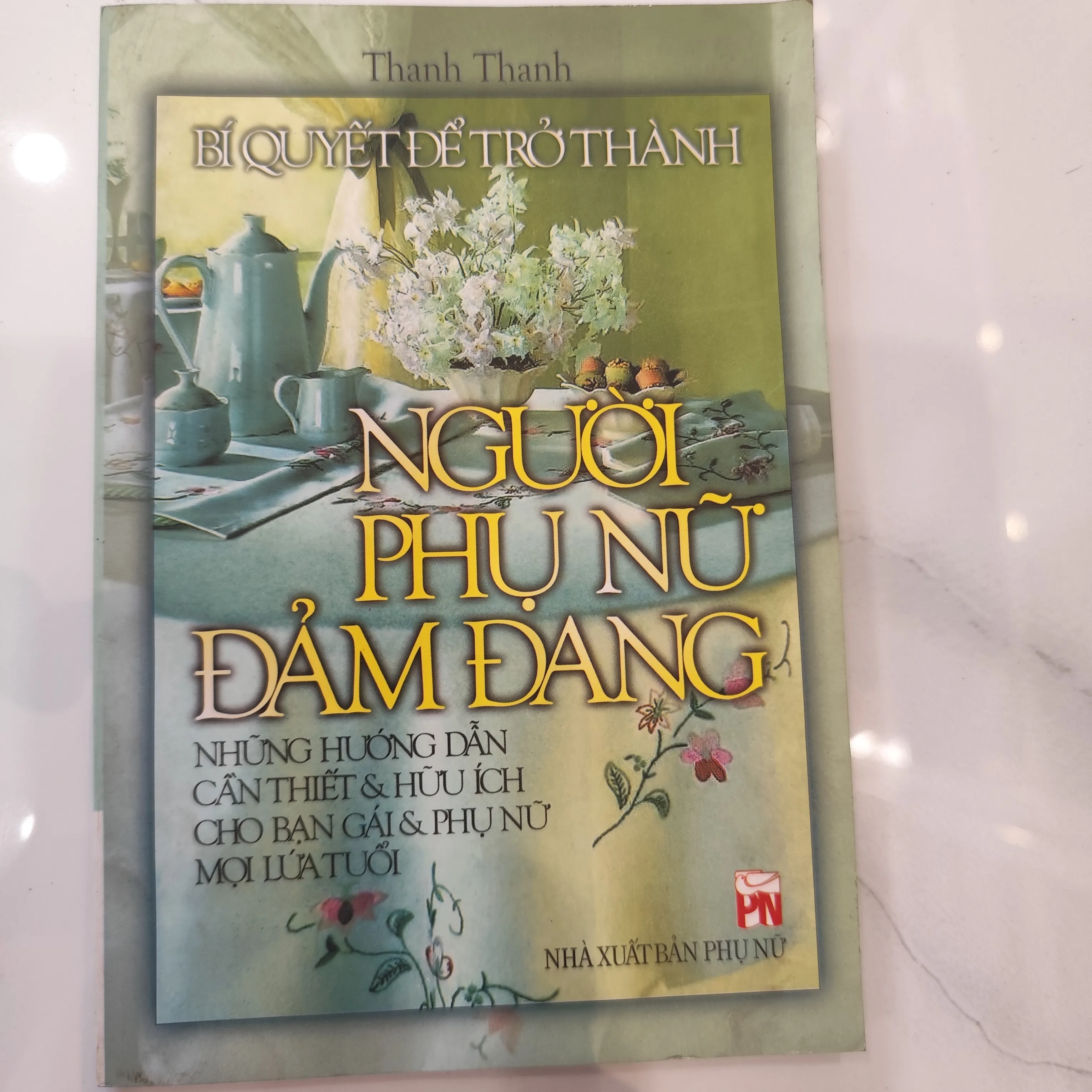 Bí Quyết Để Trở Thành Người Phụ Nữ Đảm Đang" của tác giả Thanh Thanh. by  - Sách Book Cover - Ngọc Hiển Books