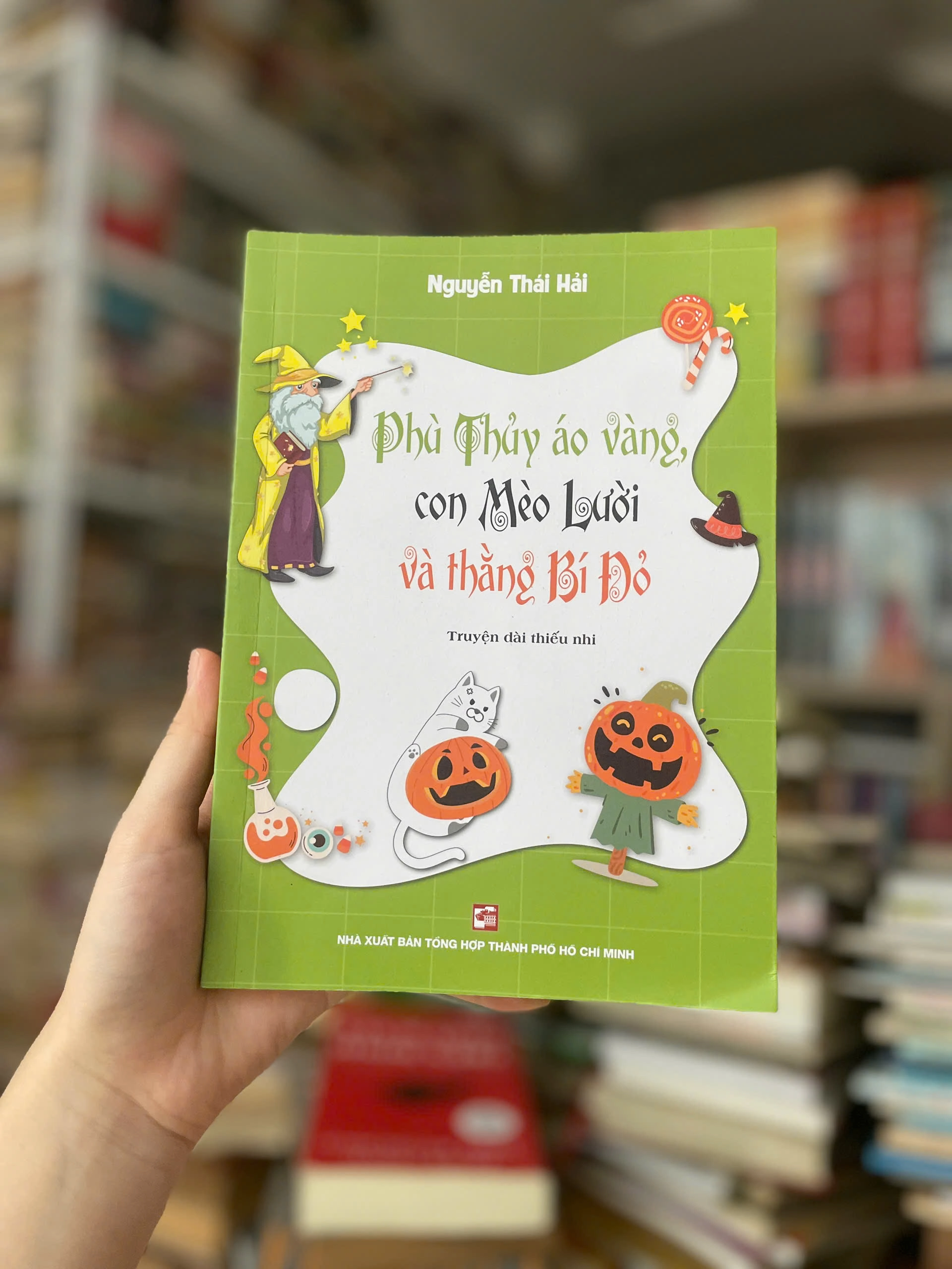 Phù Thủy Áo Vàng, Con Mèo Lười Và Thằng Bí Đỏ by Nguyễn Thái Hải - Sách Book Cover - Ngọc Hiển Books
