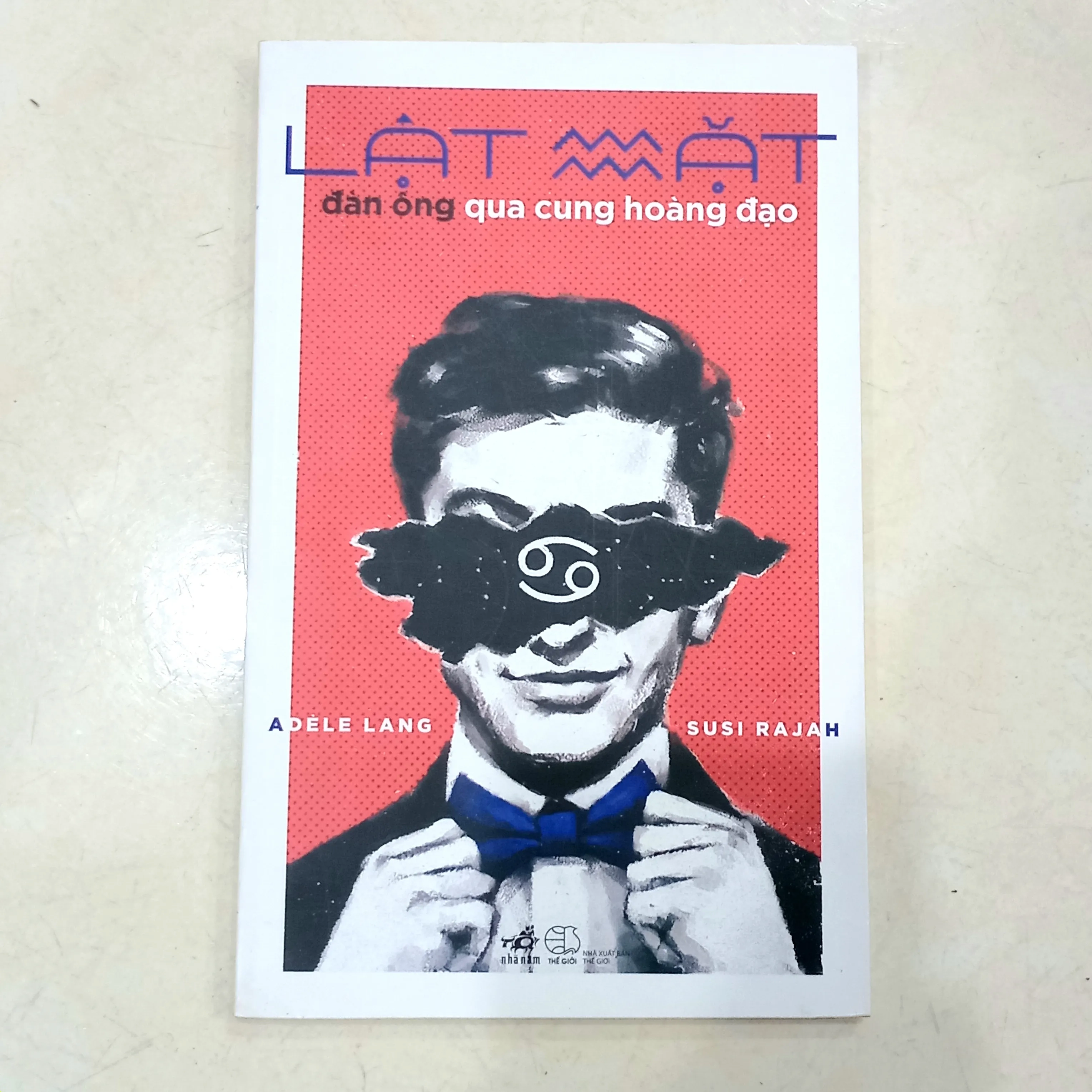 Lật Mặt Đàn Ông Qua Cung Hoàng Đạo by Adèle Lang, Susi Rajah - Sách Book Cover - Ngọc Hiển Books