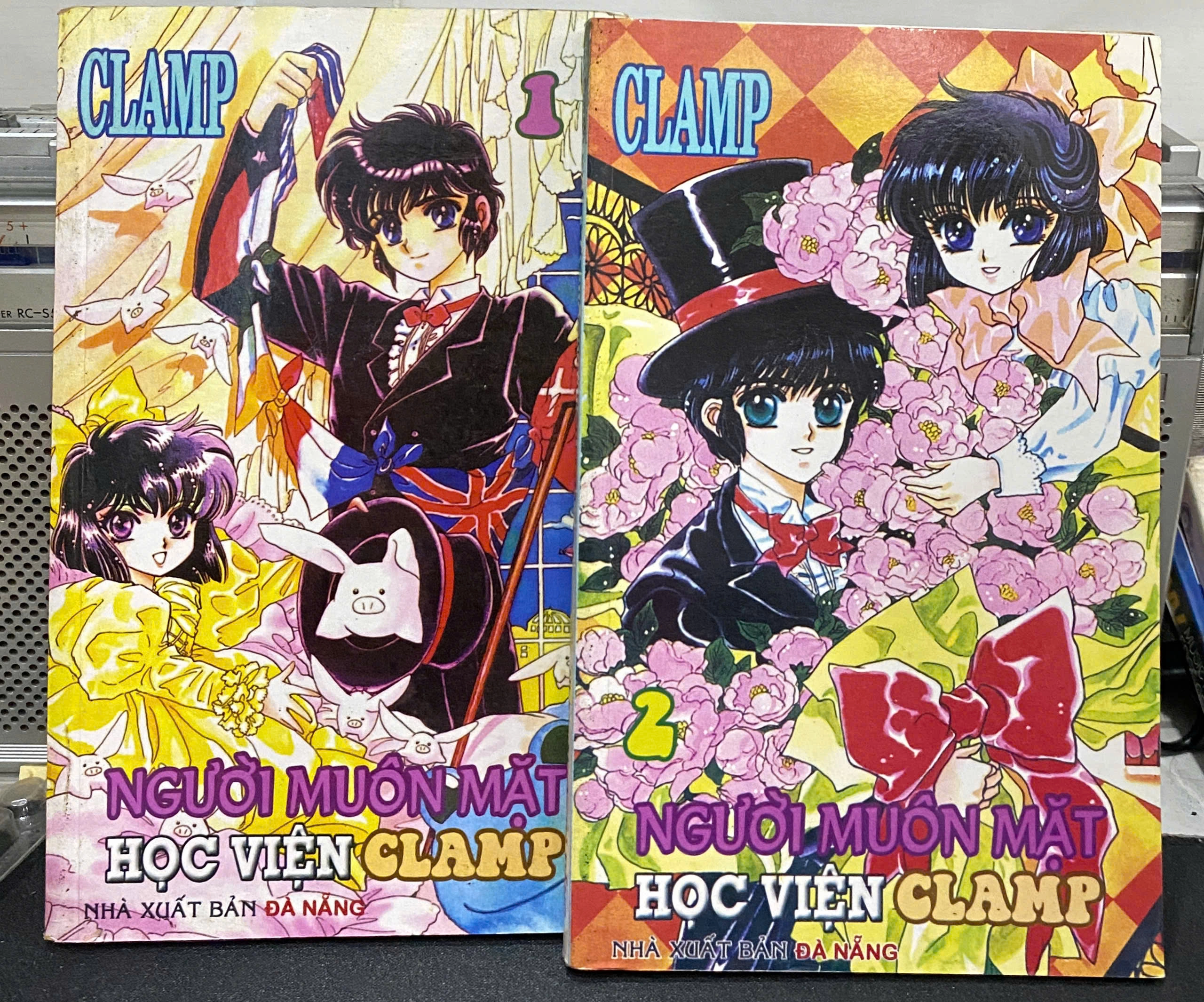 Người muôn mặt học viện Clamp by  - Sách Book Cover - Ngọc Hiển Books